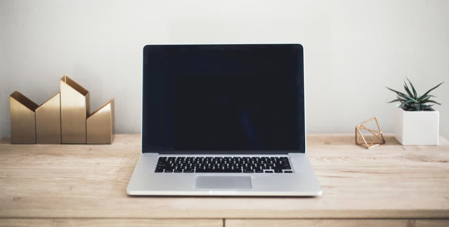 macbook on minimalist desk