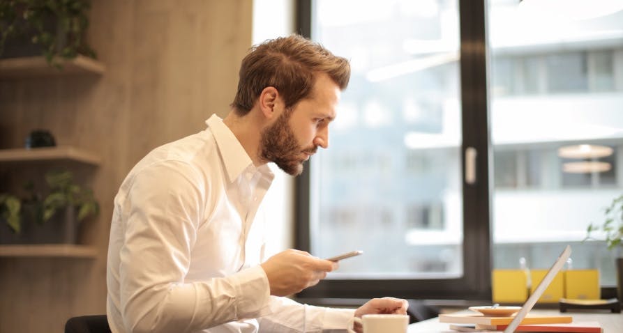 man looking at his computer