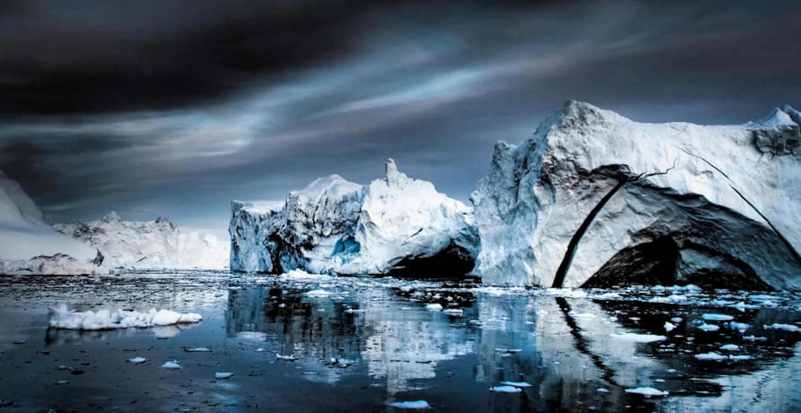 ice caps melting under dark sky