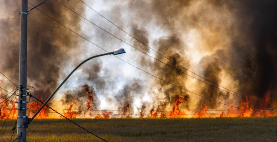 fire causing smoke in air near power lines