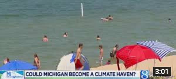 people on beach michigan climate haven