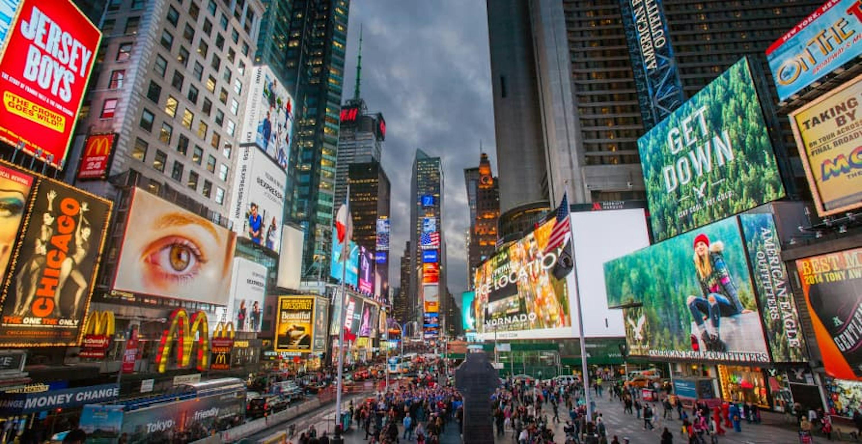 view of times square in nyc at night