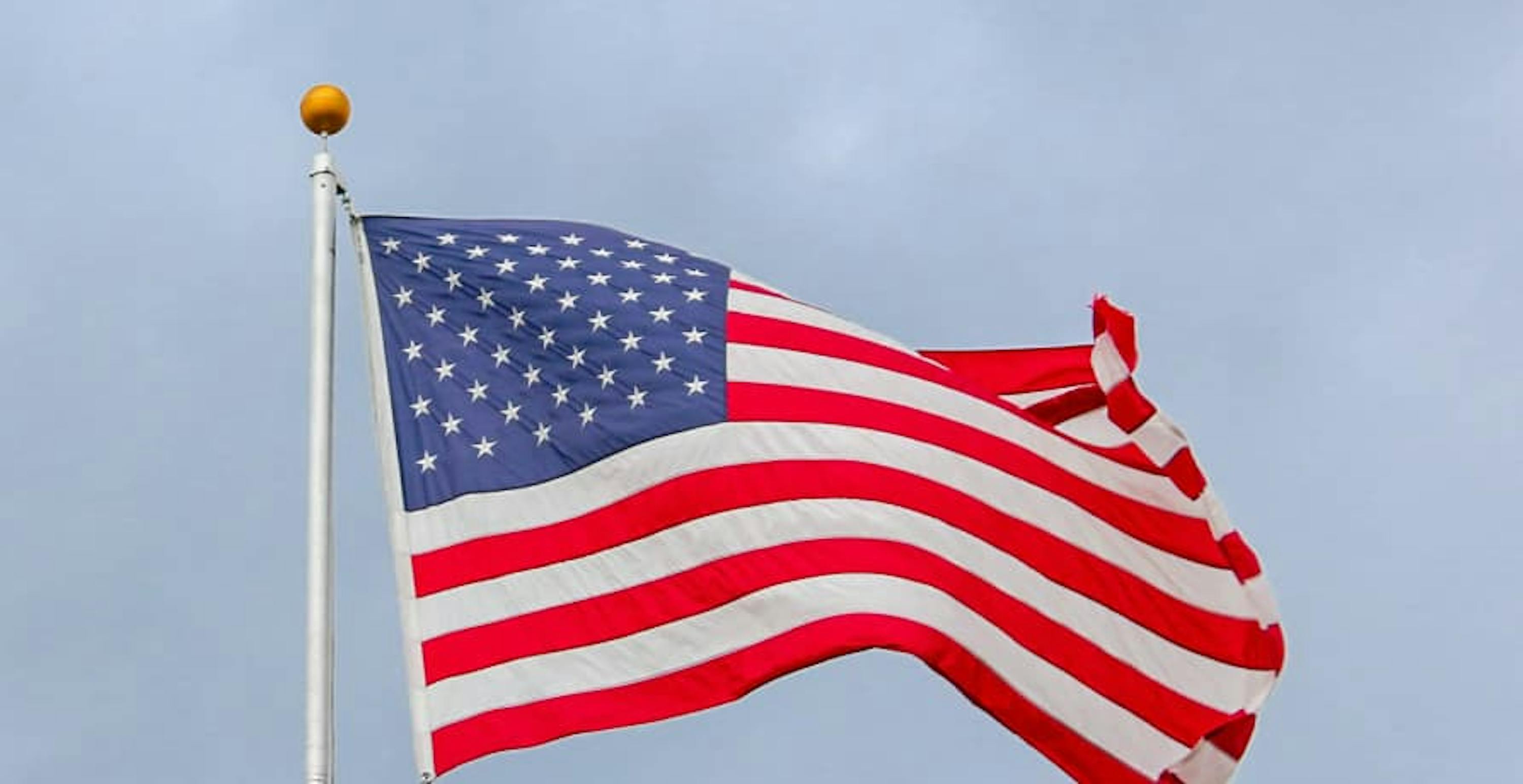 US flag against blue sky