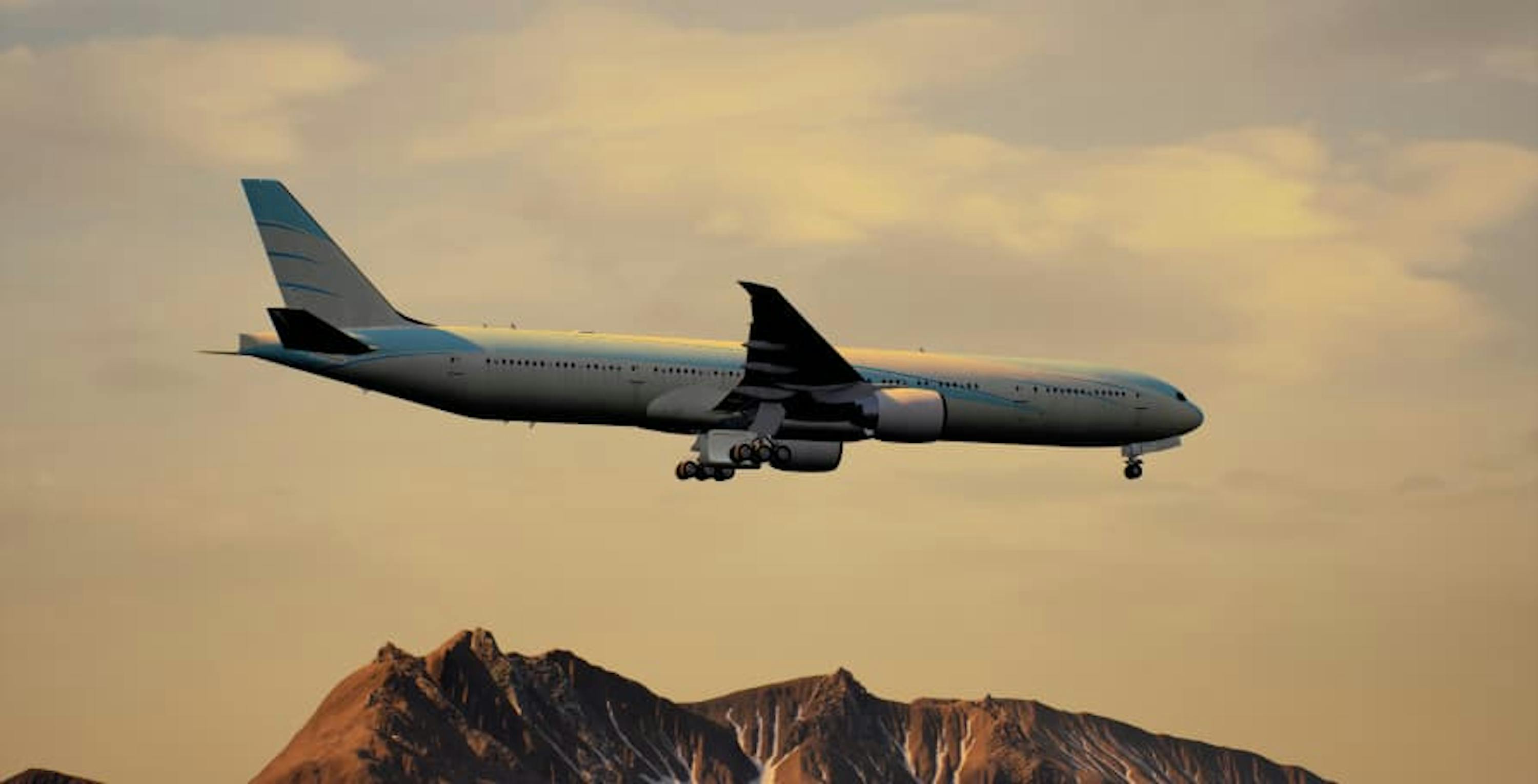 plane landing in sunset above red rock