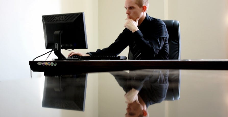 a man who is working on a computer