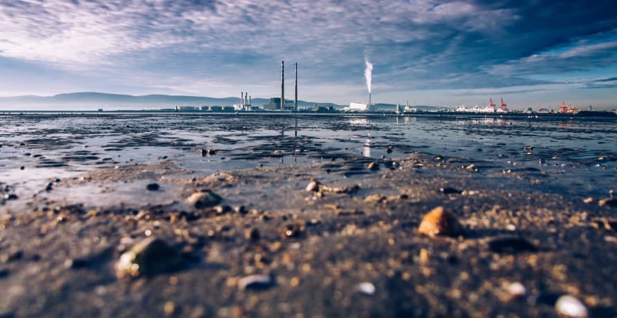 polluted water city in the distance