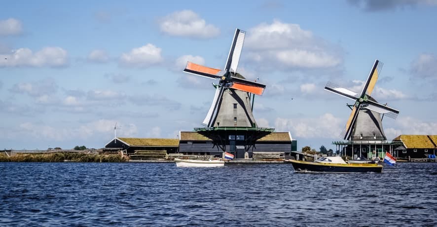 view of windmills on water in soest netherlands