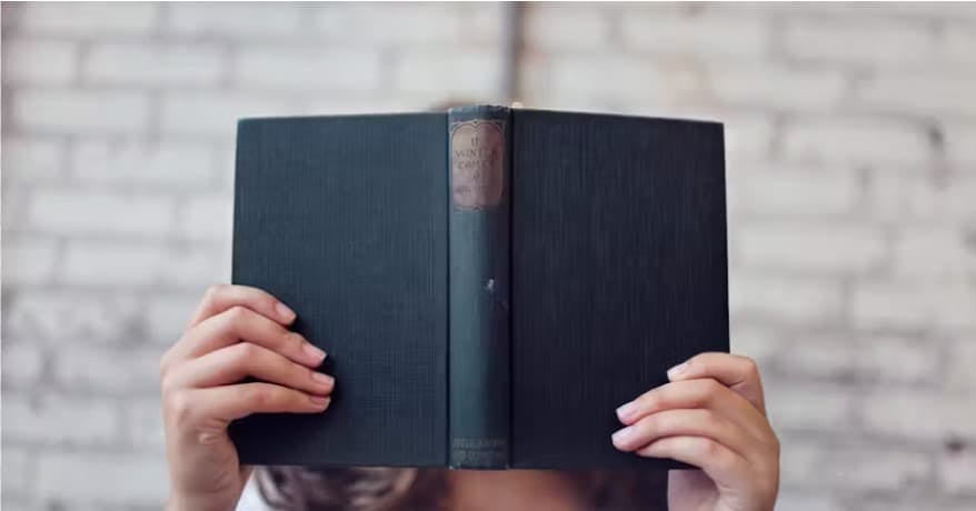 person holding book