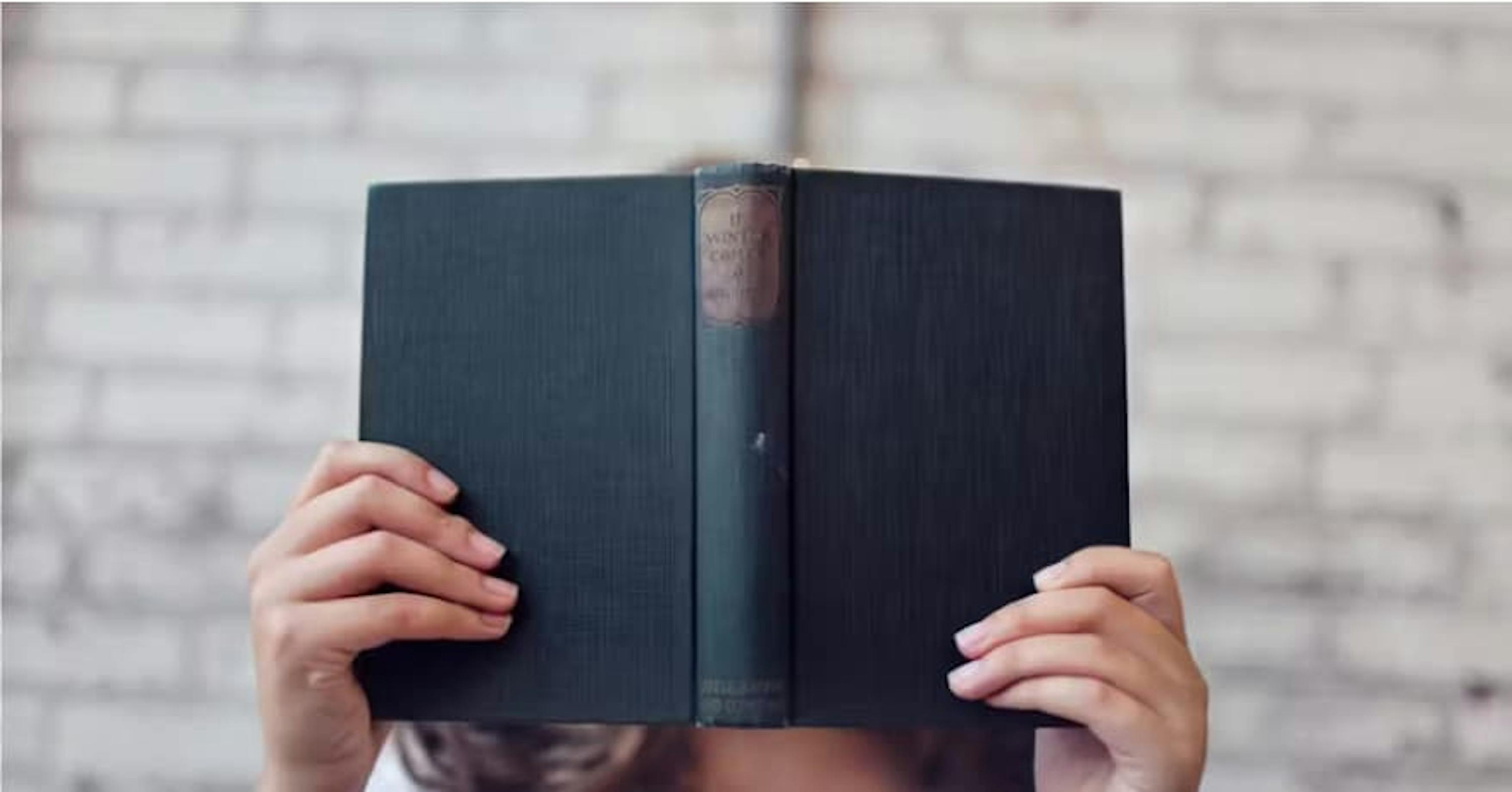 person holding book