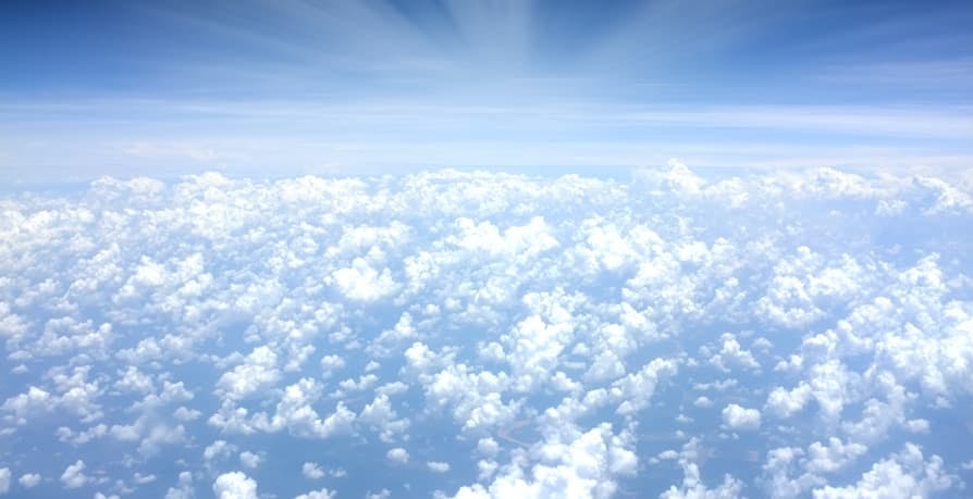 blue sky and puffy clouds