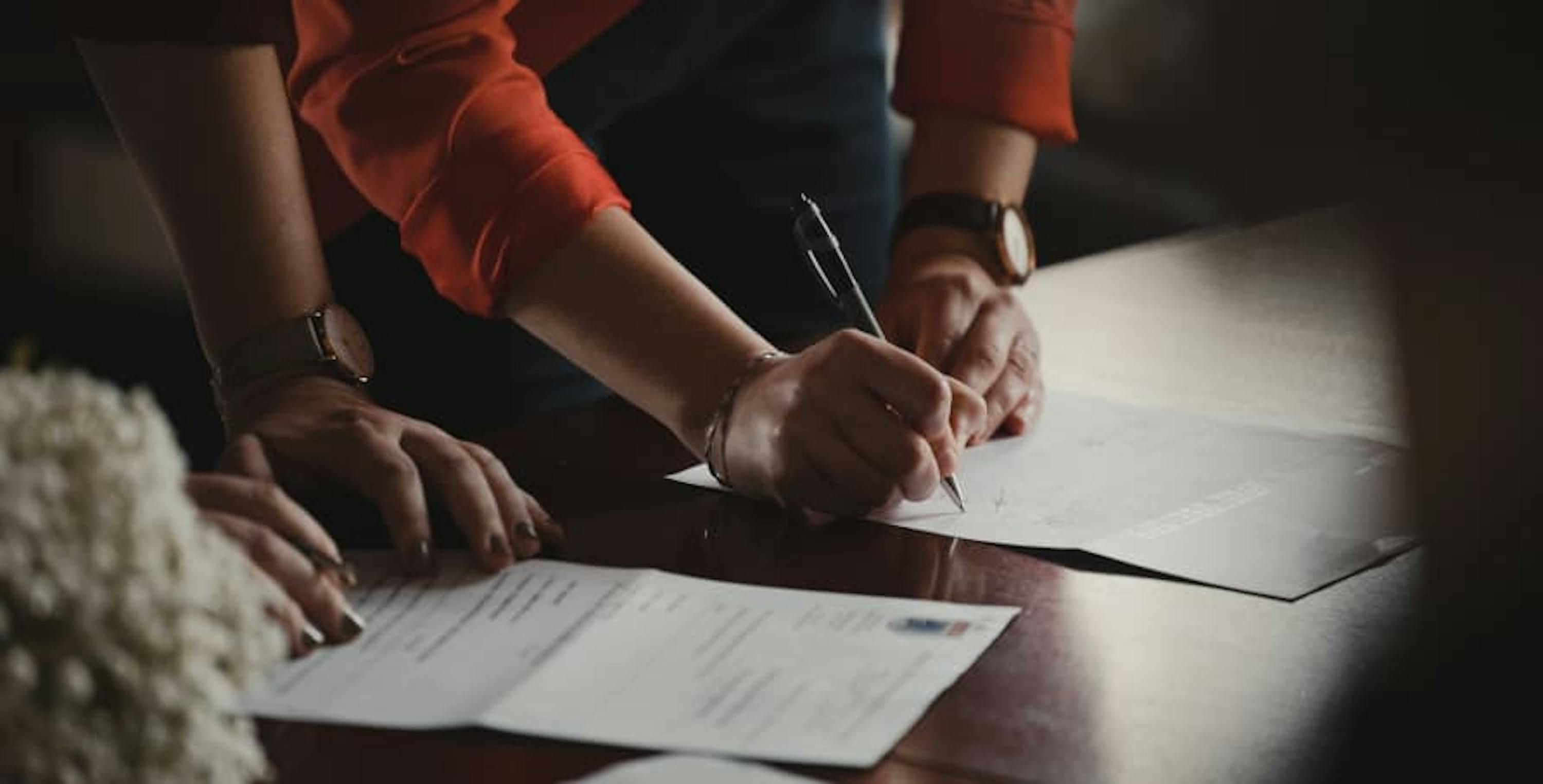 person signing papers