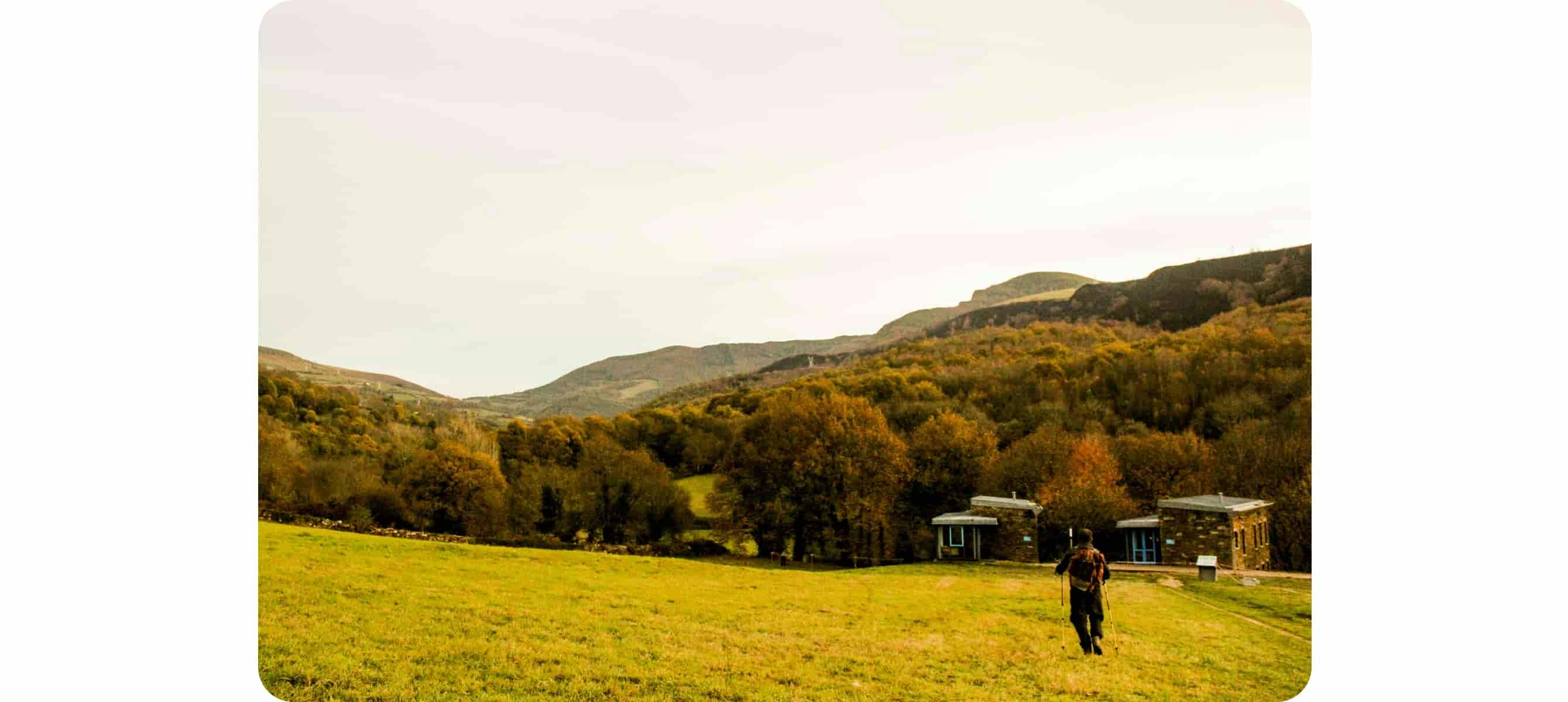 Person standing at green field