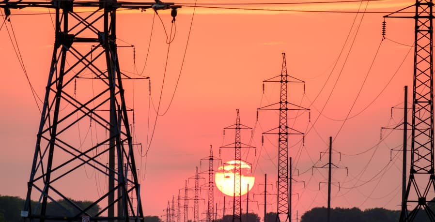 orange sunset over power grid