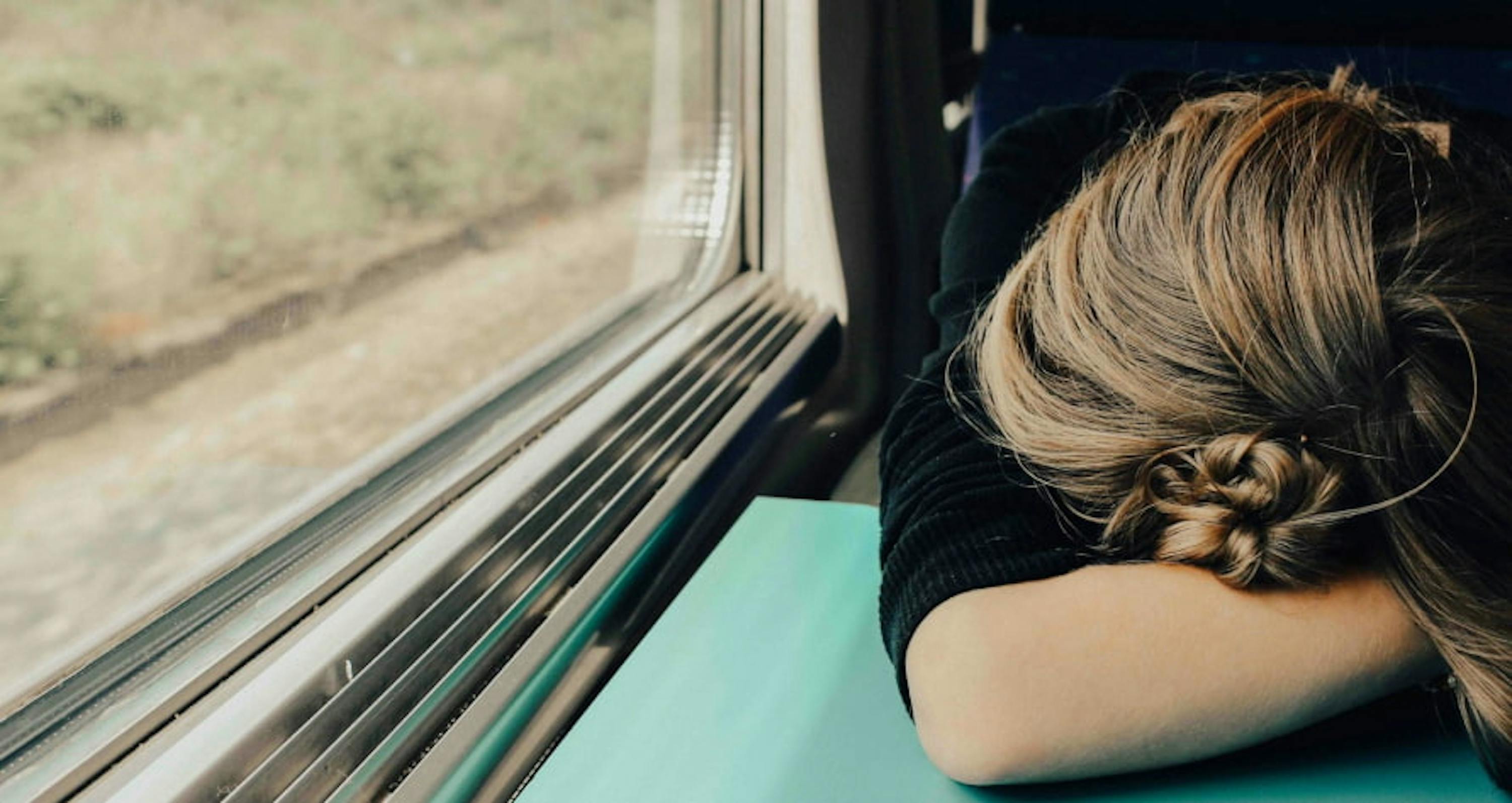 a woman sleeping on a table