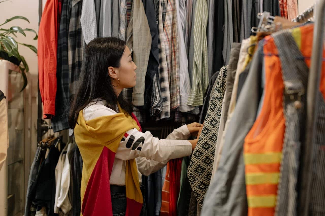 Woman in a secondhand clothes shop