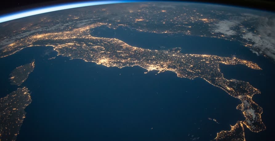 shot of the Earth taken from outer space showing countries lit up at night