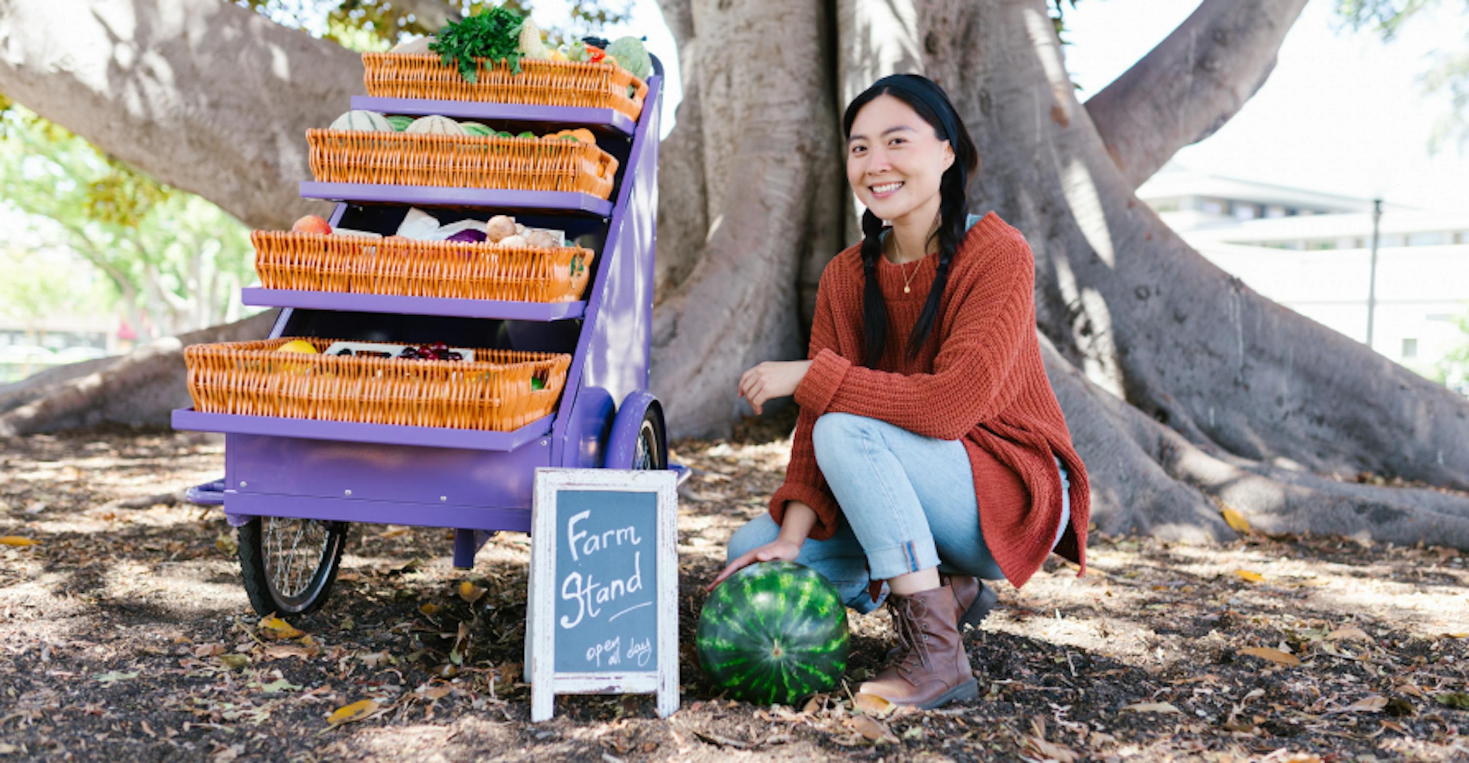 girl in nature learning about produce