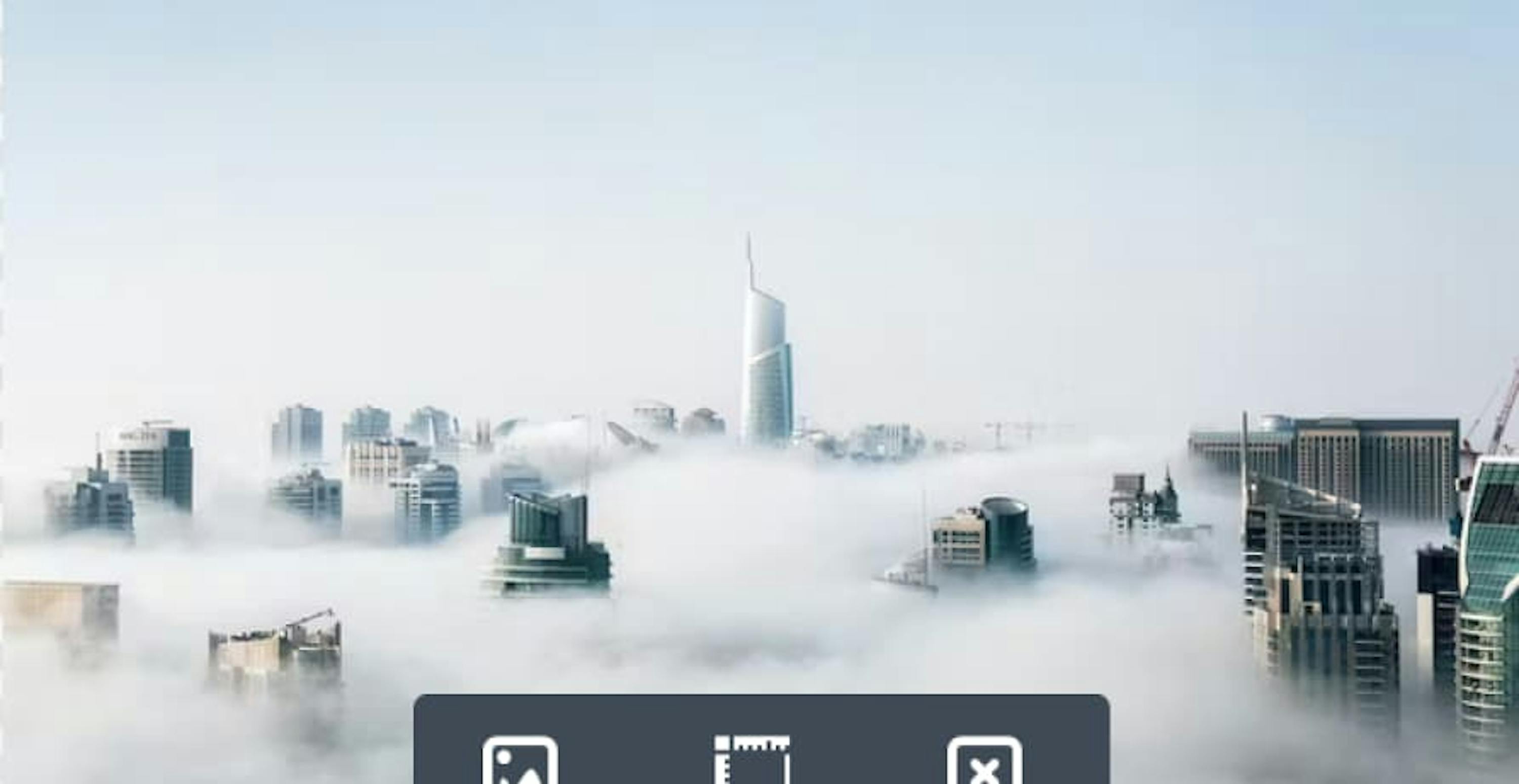 skyscrapers above clouds