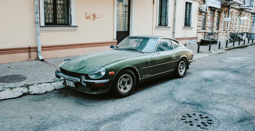 second hand car parked on street road