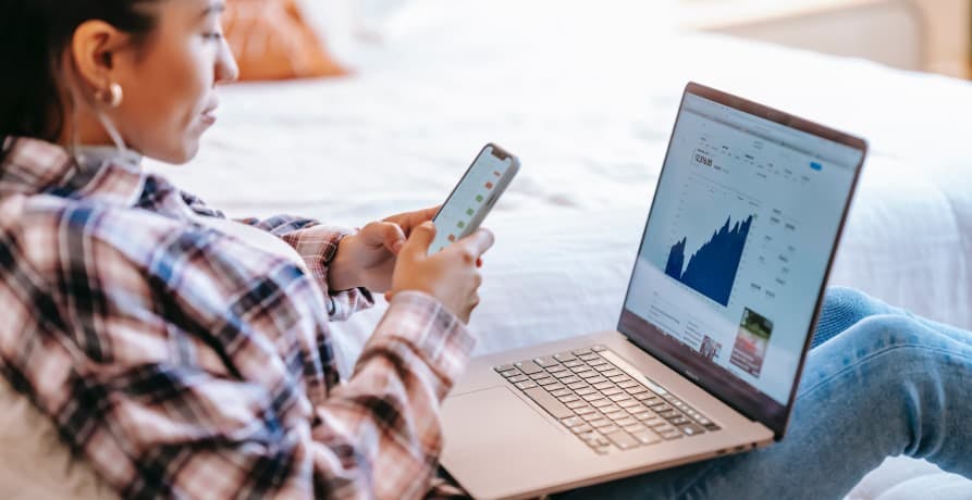 woman looking at data on her laptop