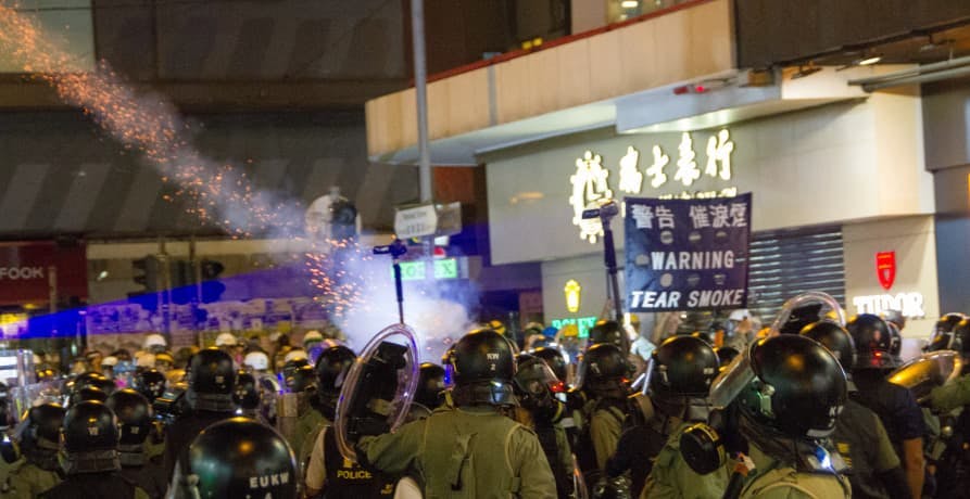 Protestors in Asia with riot police
