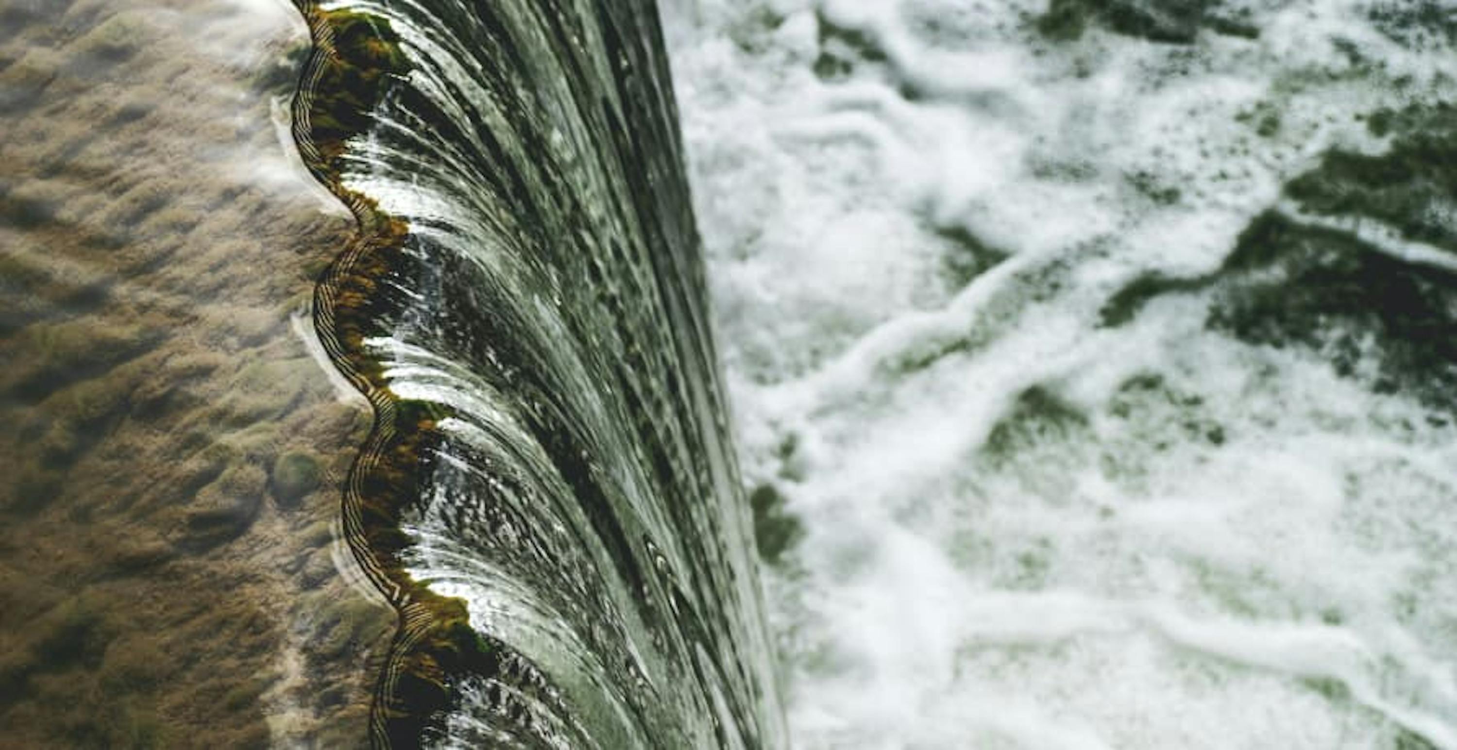 water flowing down a dam