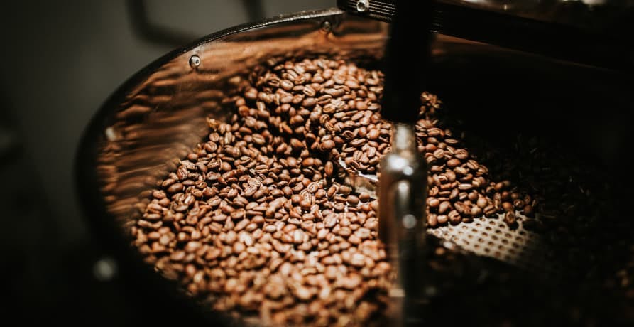 coffee beans in. barrel
