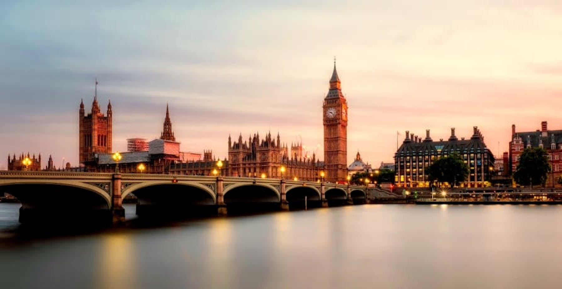 Westminster and the Thames River in London at sunset