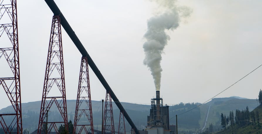 smoke pollution being released into the air from factory