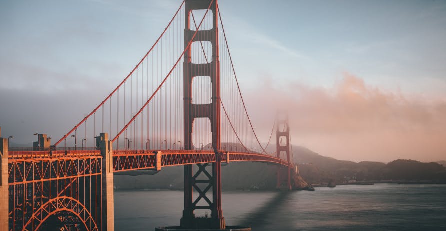 golden gate bridge with pink clouds