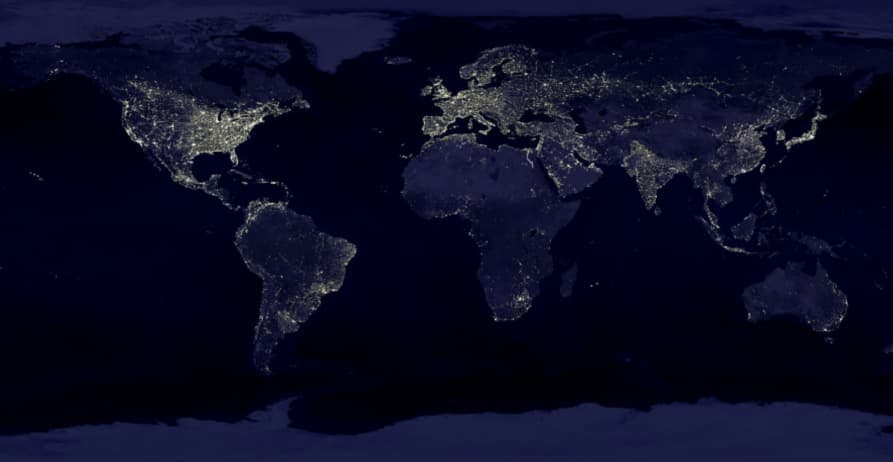 map of the world at night with cities lit up