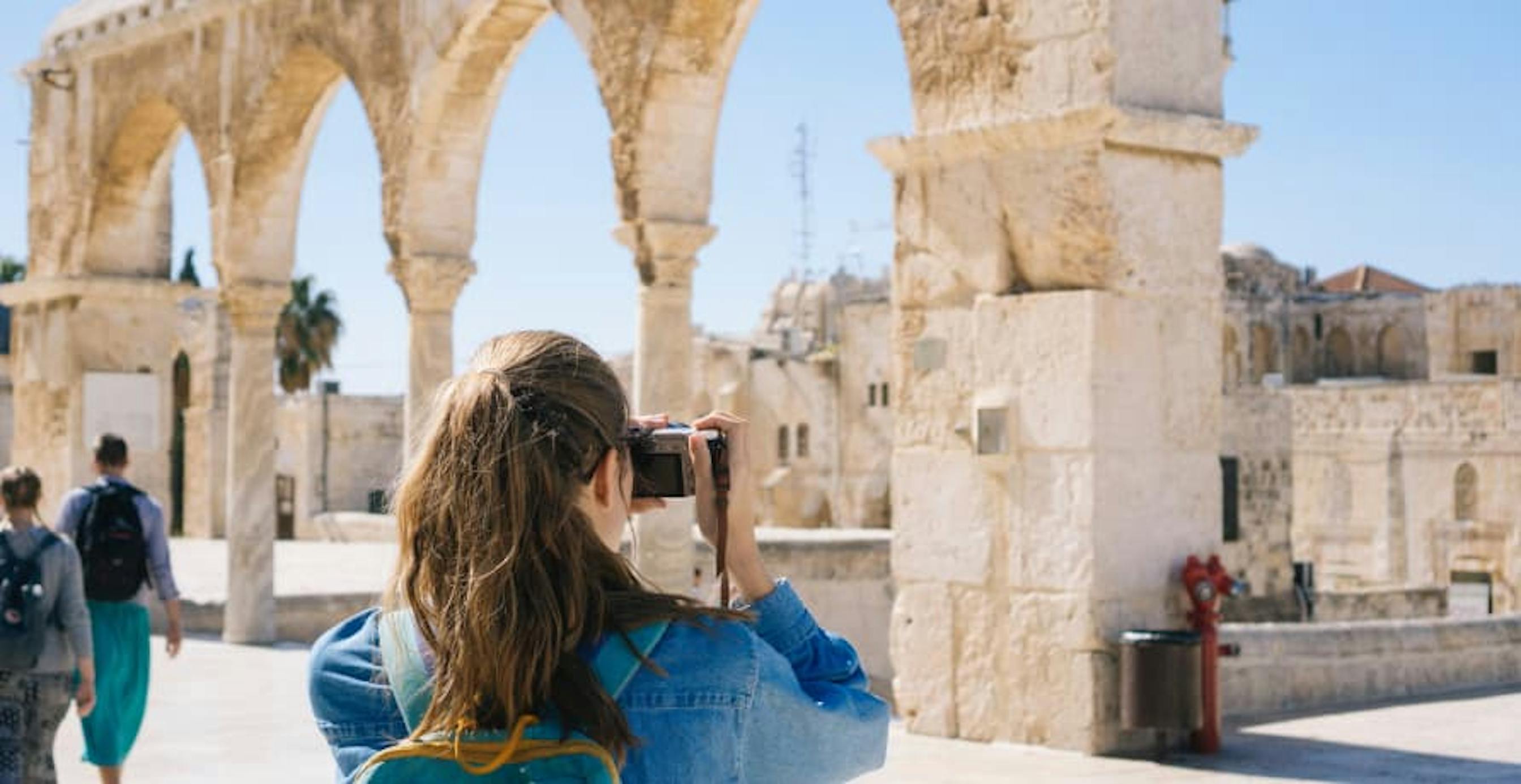 traditional tourist taking pictures