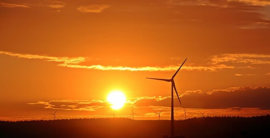 wind turbine in orange sunset