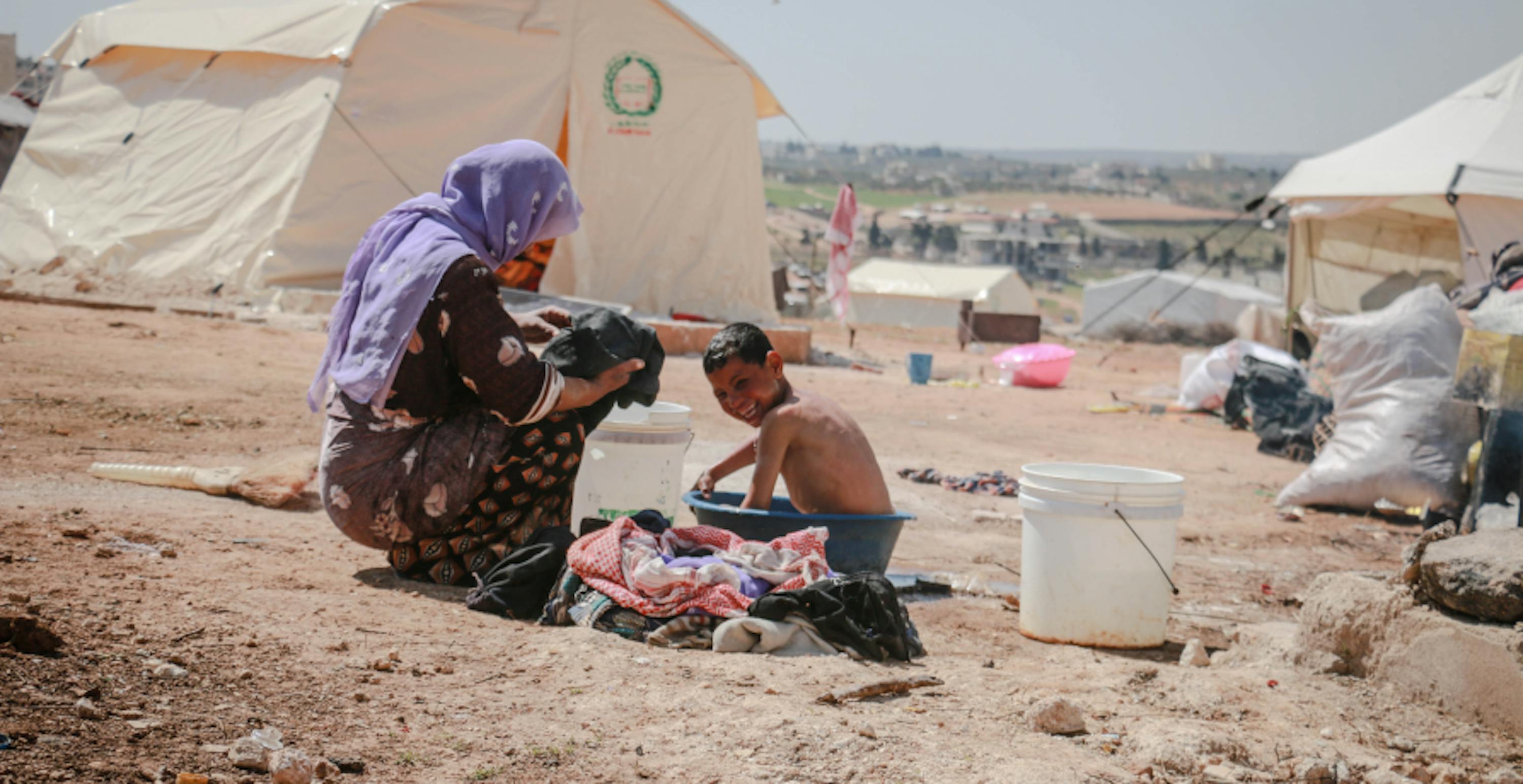 woman with her child in a refugee camp