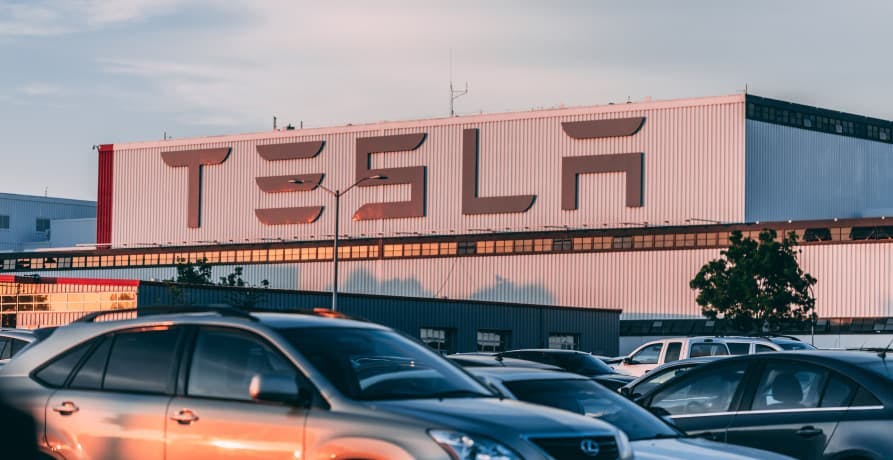 Tesla car factory with cars outside