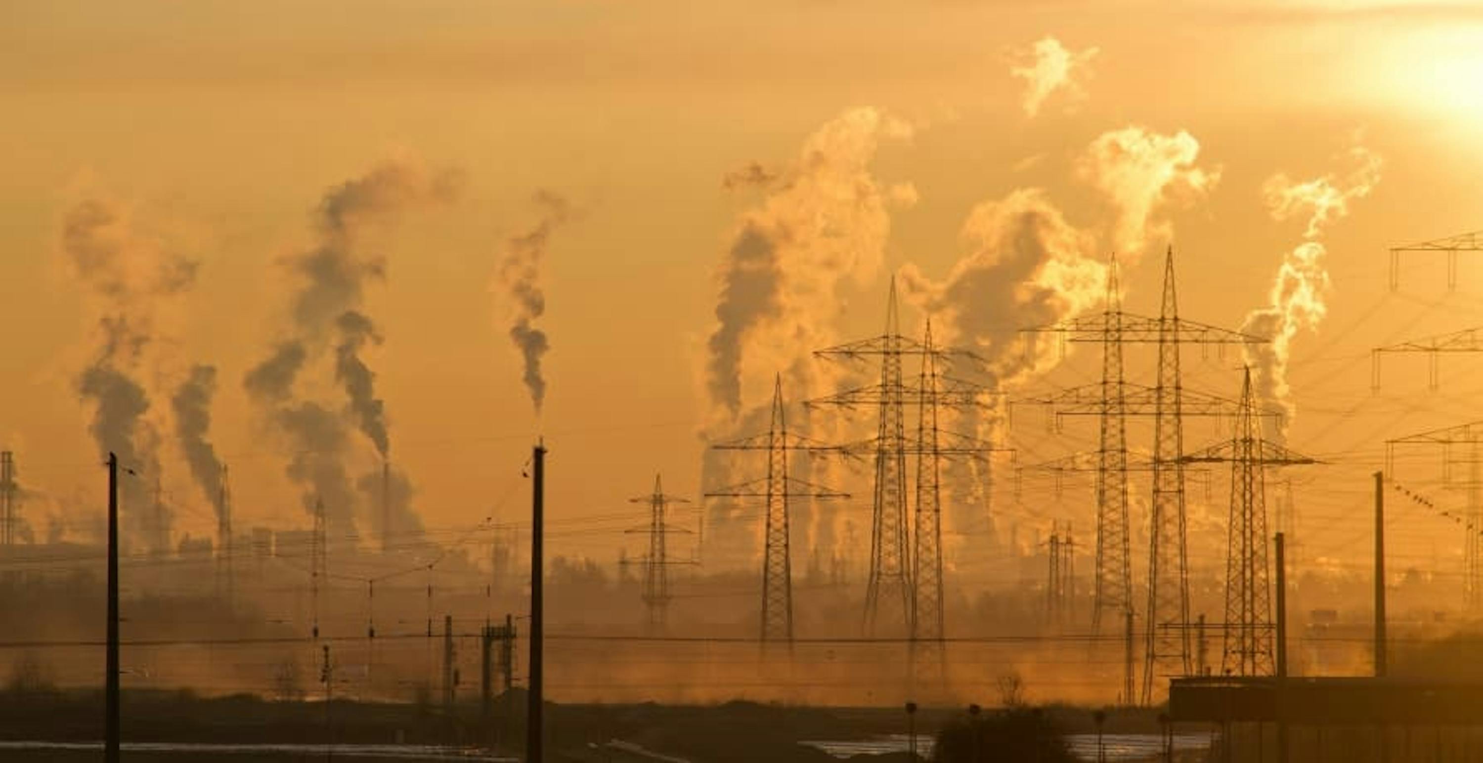 view of power plants and factories releasing pollution into the air