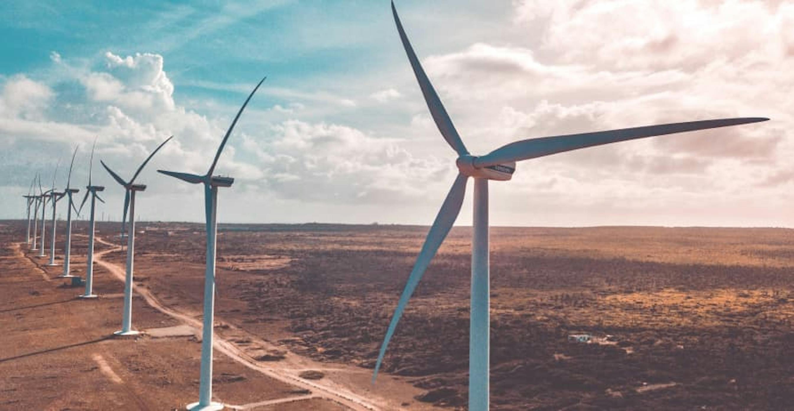 wind turbines up close in dry area