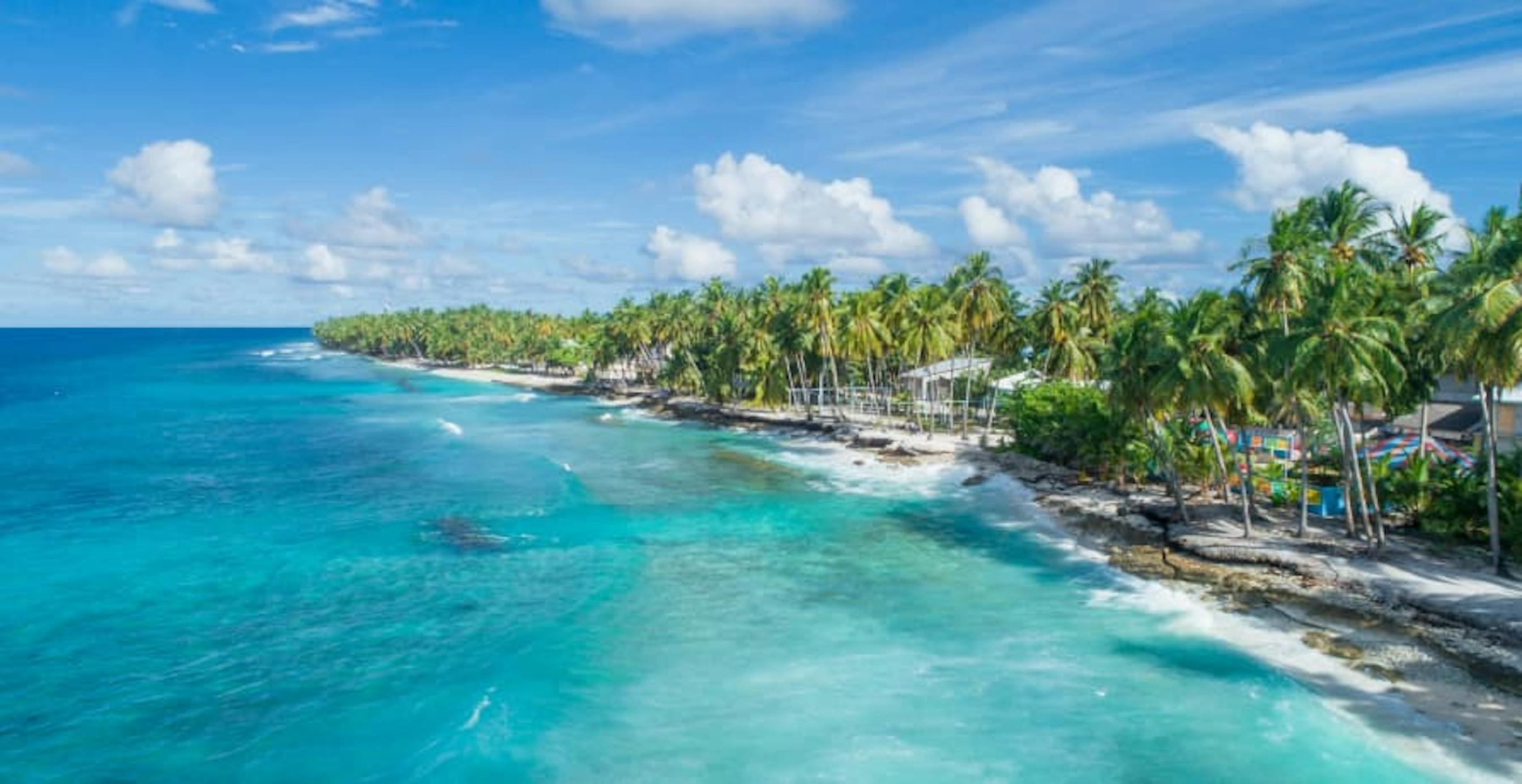 tropical island with blue ocean water and clear beaches