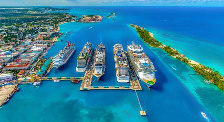 cruise ships docked in bright colored water