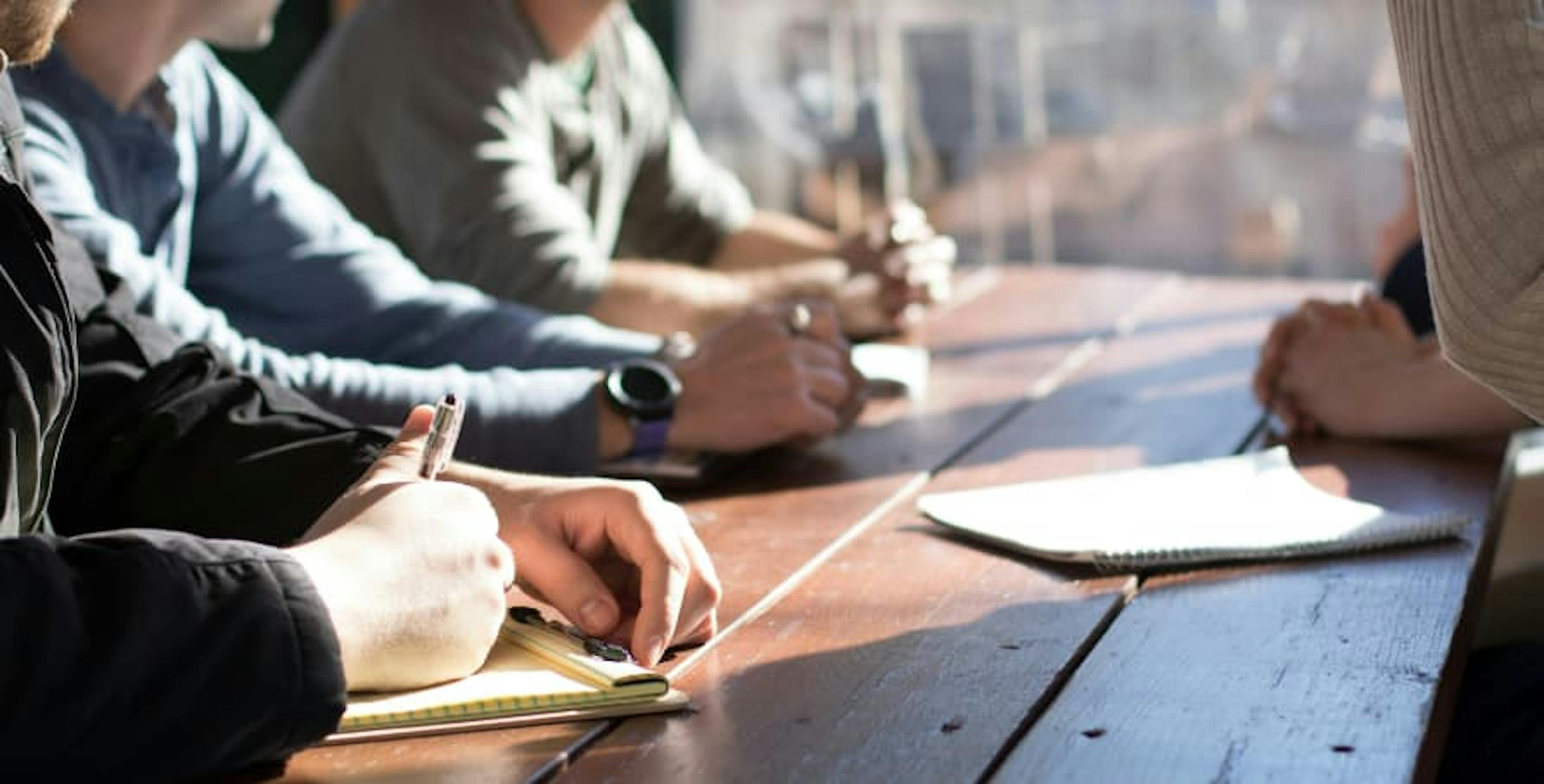 people sitting in business meeting