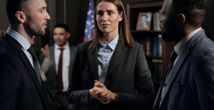 people in suits discussing