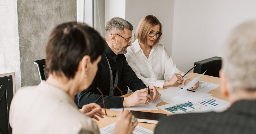 colleagues attending a meeting