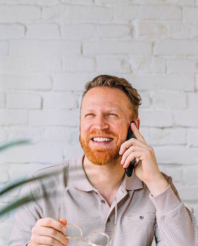 Man smiling at phone