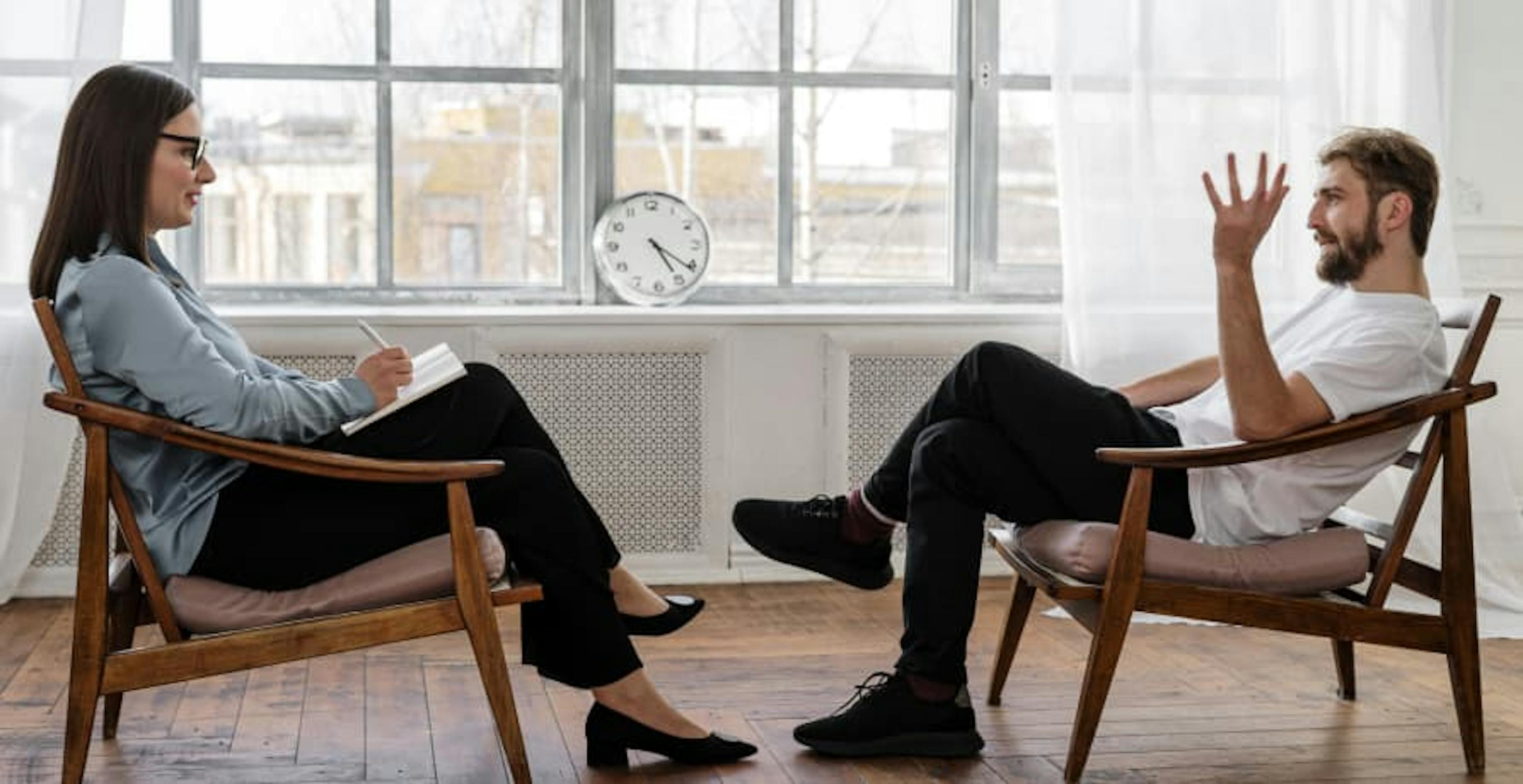 two people talking in a meeting room