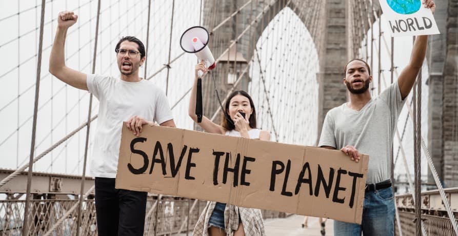 people on brooklyn bridge protesting for climate change