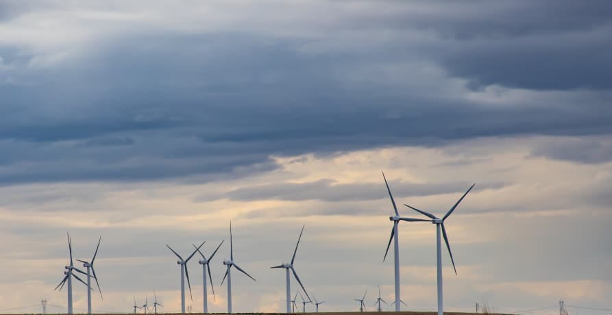 wind turbines against a cloudy sky