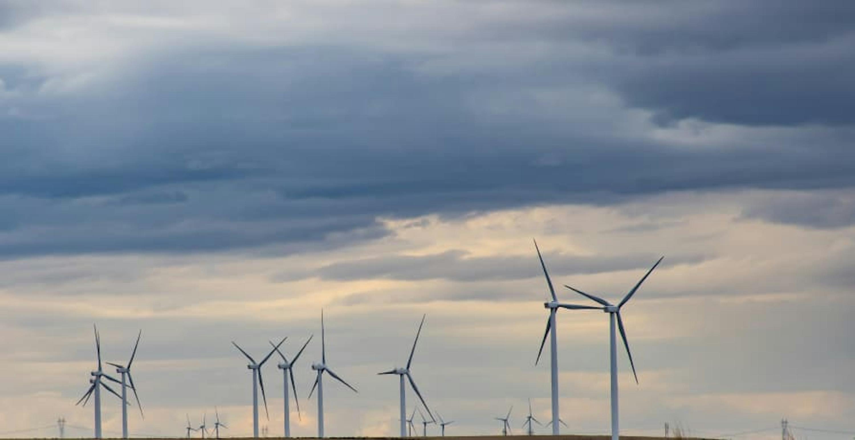 wind turbines against a cloudy sky