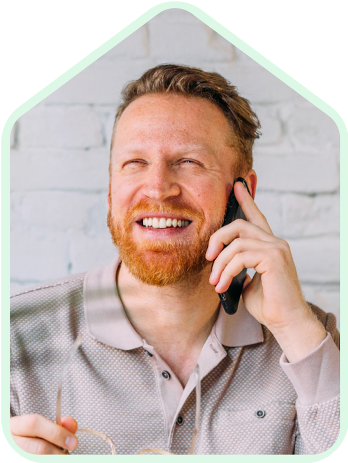 A man on phone smiling