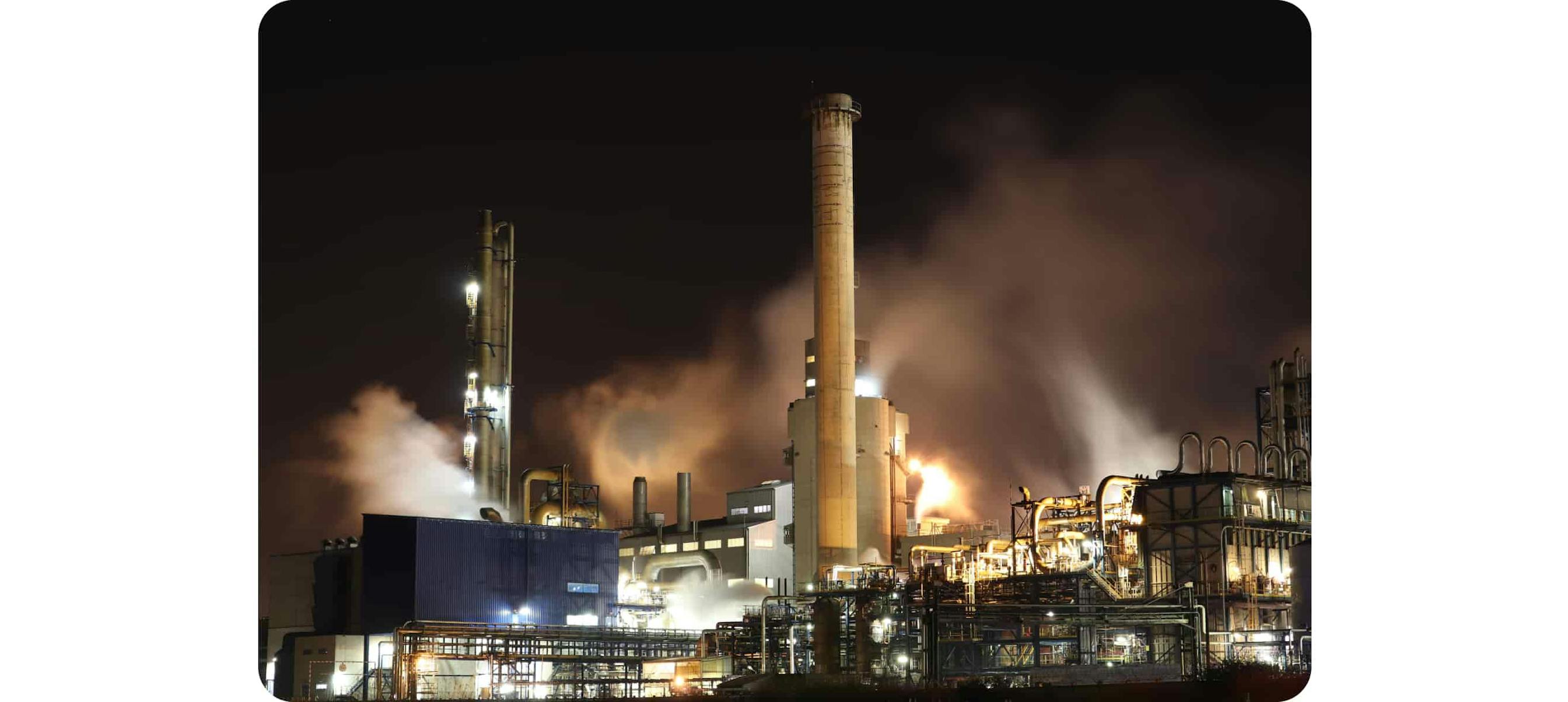 Brown and White Factory Building during Night Time