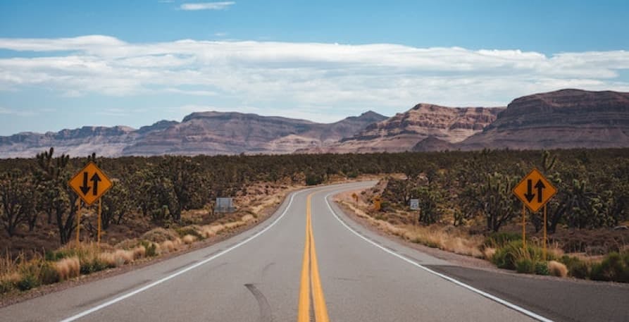 open road and rocky mountains 